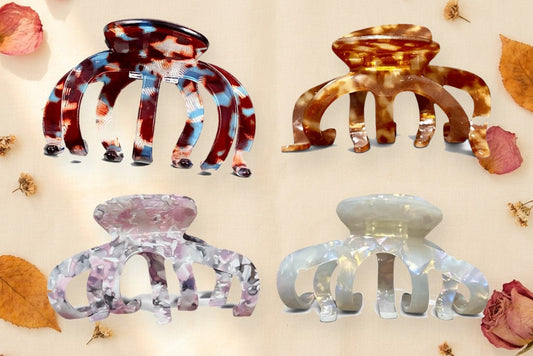 Die vier Jelly Clips Tortoise, Amber, Pink und Coconut Glow auf Leinen